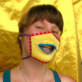 Hannah in a yellow mask